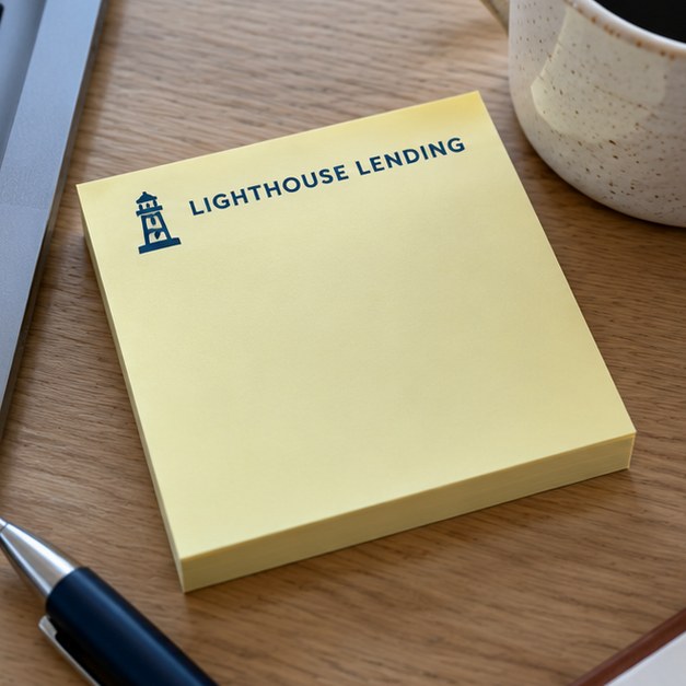 Customer photo of branded sticky notes on a desk